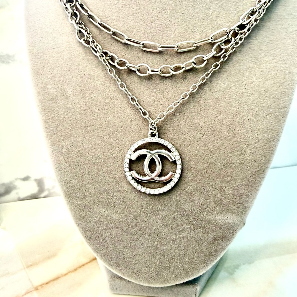 Chic Silver Triple Layer Necklace with Iconic Pendant